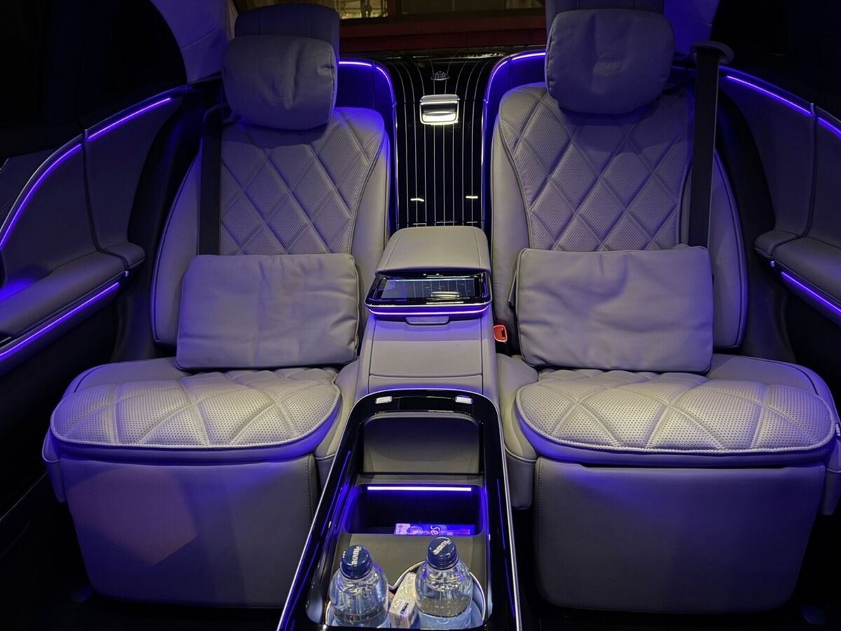 The rear cabin of the SOIT Mercedes-Maybach S-Class: two seats either side of a centre console.
