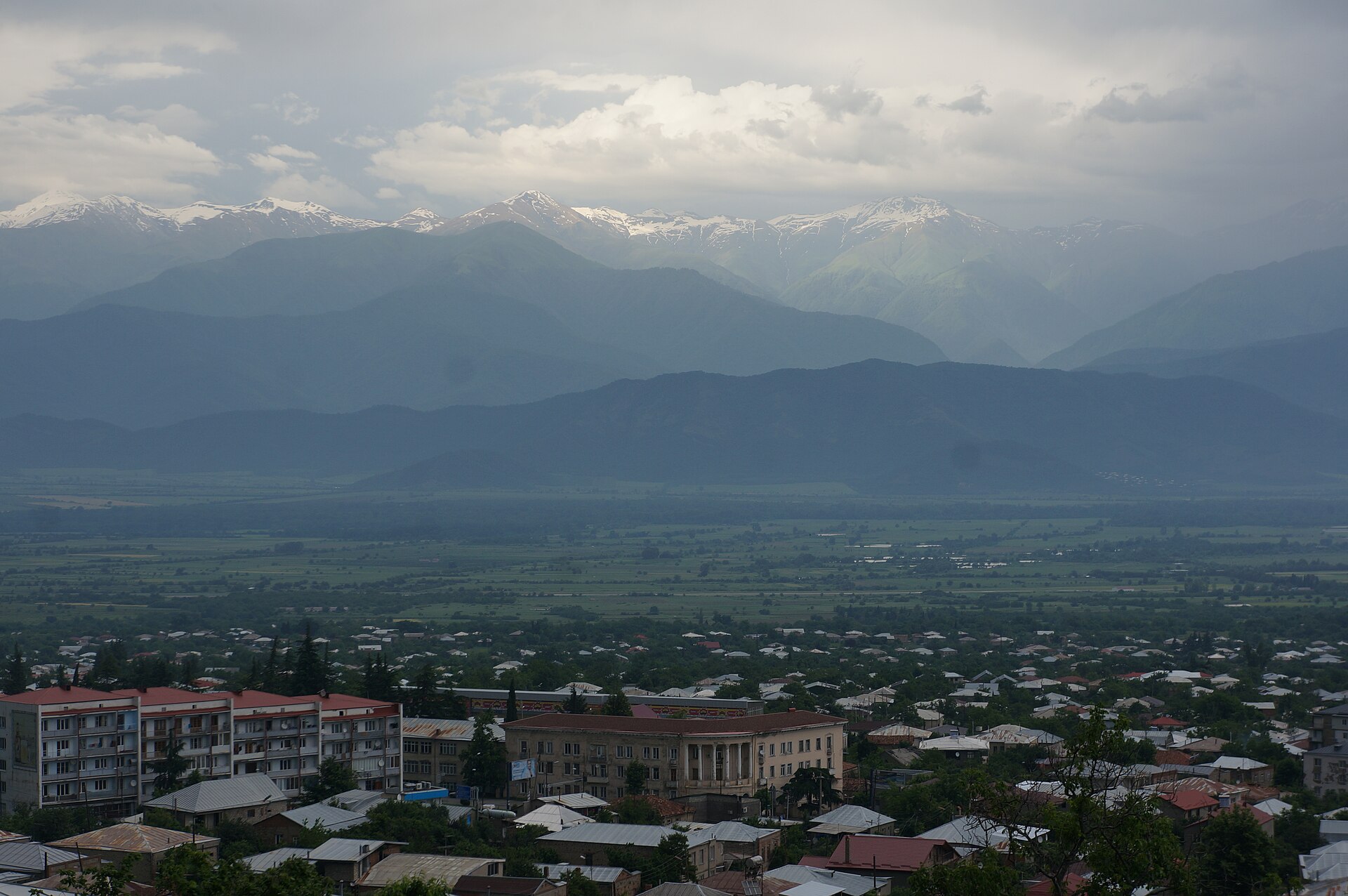 The town of Telavi spread below the foothills, the green Alazani valley running out to the snow-capped Caucasus mountains in the distance.